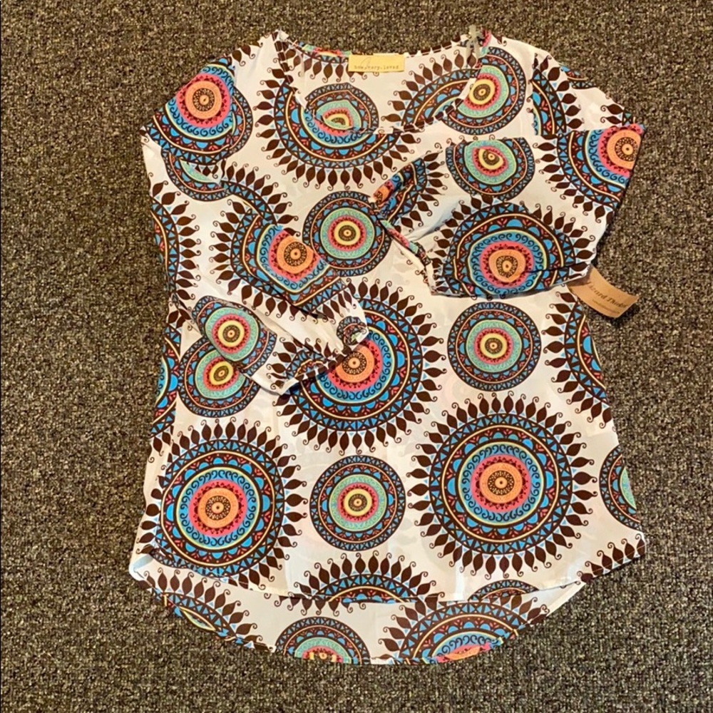 Cute, loose fitting 3/4 sleeve, fun shirt!